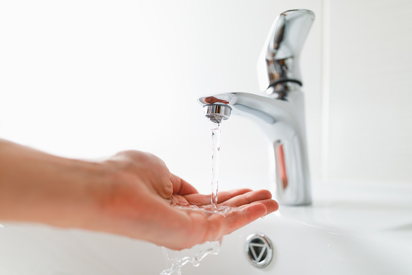 hand under faucet low water pressure